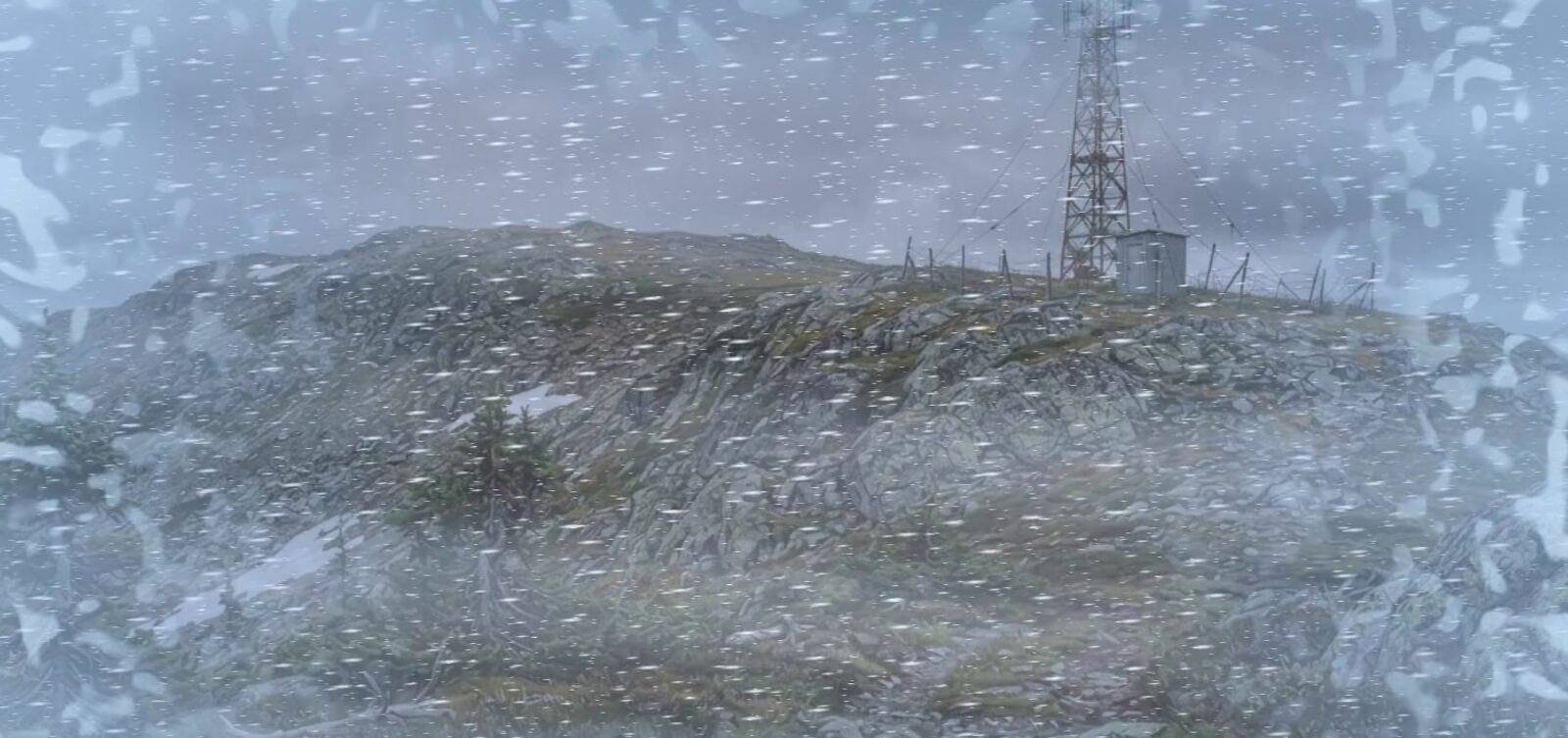 A whiteout on bare hills, a radio mast half hidden in the snow